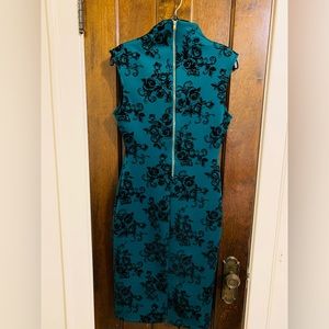 Emerald green & black dress.